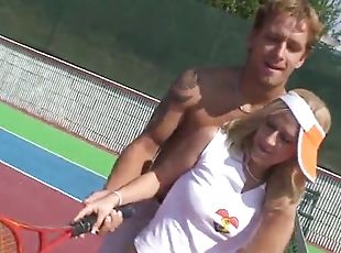 Horny couple has sex in an outdoor tennis court