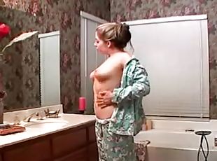 Busty Haley Scott takes a bath and plays with her pussy