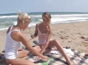 Sexy teen honeys swimming and fooling around on a beach