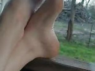 Feet Relaxing On Porch