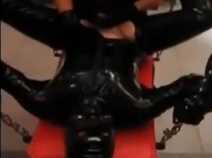 Fucking my slave in latex with a strap-on