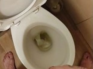 Skinny teen with erected cock takes a piss