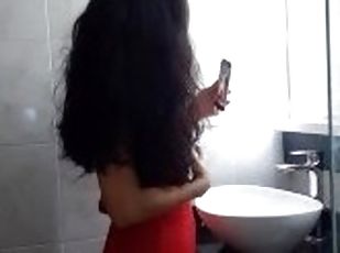 My neighbor is filmed in her bathroom showing me her tits and her vagina