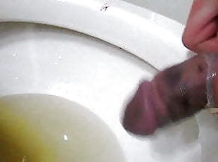 CBT broken cock pissing and wanking in condoms