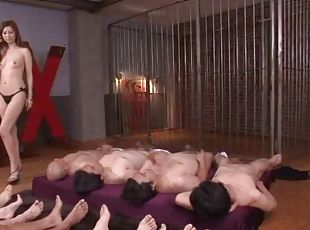 Two Japanese girls get to work satisfying a room full of guys