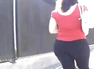 Big-assed amateur brunette wearing legging in voyeur cam clip