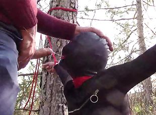 Tied to a tree on a sexy outfit, masked and outdoor deepthroat with no mercy