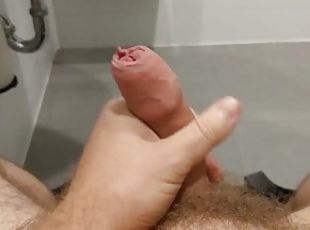 Stroking my dick in the mall public bathroom