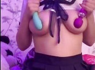 Dirty teen plays with her tits with two vibrators