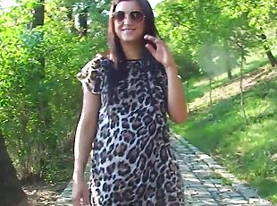 Hot brunette shows some goods during a walk