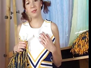 Pigtaield cheerleader sticks pom pom handle inside her twat