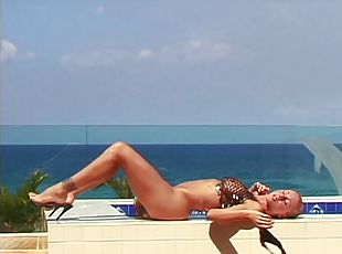 Blonde pornstar sucks dick by the pool before getting fucked