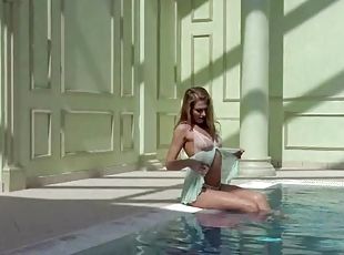 Teen in lingerie goes for a swim in the pool