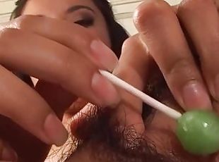 Lizzy play with a lollypop and wih a big vibrator in her hairy cunt
