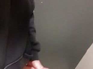 guy in blue jeans jerks off in the airport toilet and cums on the floor