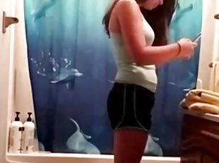 My girlfriend takes a shower without any awareness of the camera.