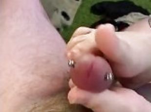 Foot job on pierced penis