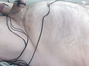 Hands free cumshot. Bound and stretched balls are swollen and shocked with estim along with nipples and cock