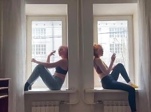 girls smoking on the window
