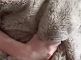 Guy masturbating with a thick faux fur blanket