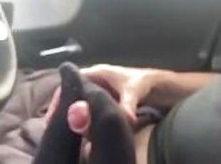 Cum on feet in black socks in car