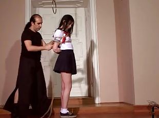Schoolgirl stands still as her body is tied up