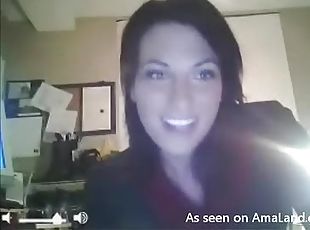 Kinky brunette strips in front of the webcam in her office