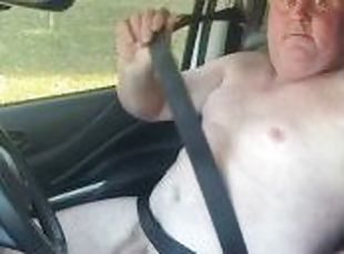 Naked driving in town on a work day