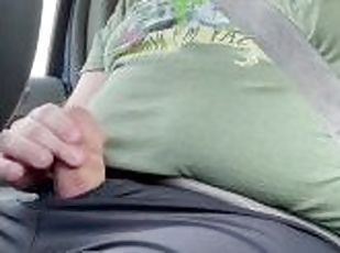 Horny daddy strokes his hard dick in truck while driving around