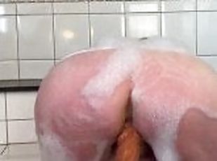 Big brown dildo fucking in the bath
