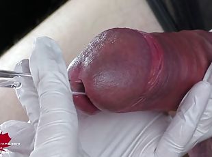 Perfect sperm extraction directly from the urethra. Close-up of the sound of a glass straw